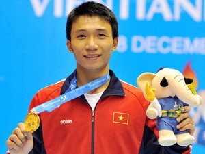 Karatedo artist Nguyen Ngoc Thanh won a gold medal in the men’s kumite 76 kg division on December 11 at the SEA Games in Laos. (Photo: SGGP)